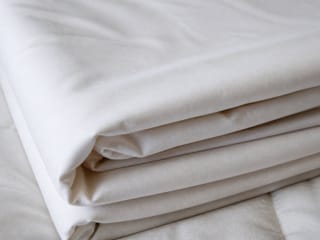 Close-up of folded bed sheets